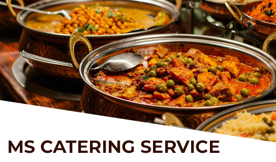 Winngoo Pages India / top restaurants A professional catering setup serving diverse event meals as part of a top restaurant service.